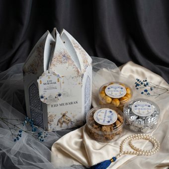 Hamper still life with tulle, satin, and pearls