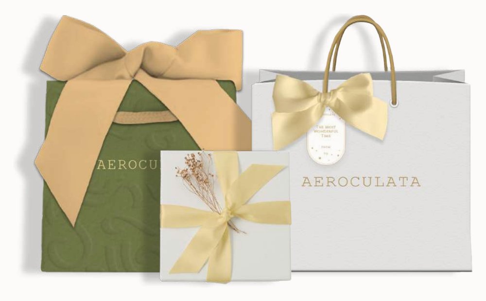 Aeroculata packaging set — sage gift box, small ribboned box, and paper bag